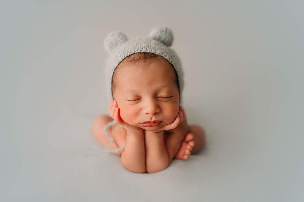 Photo of child with cap on its head